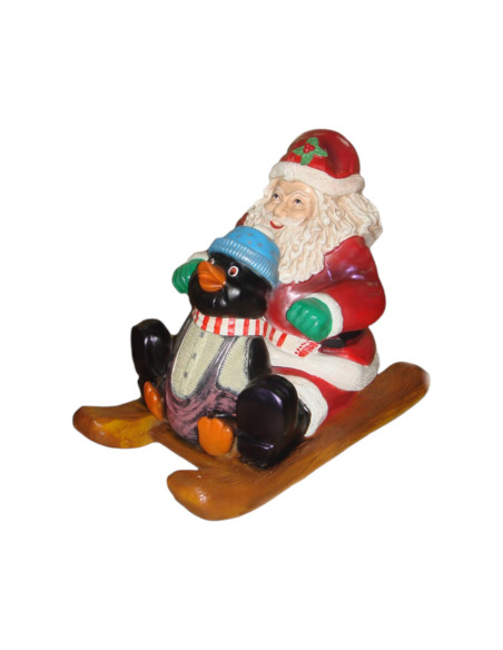 Mikołaj z pingwinem w saniach